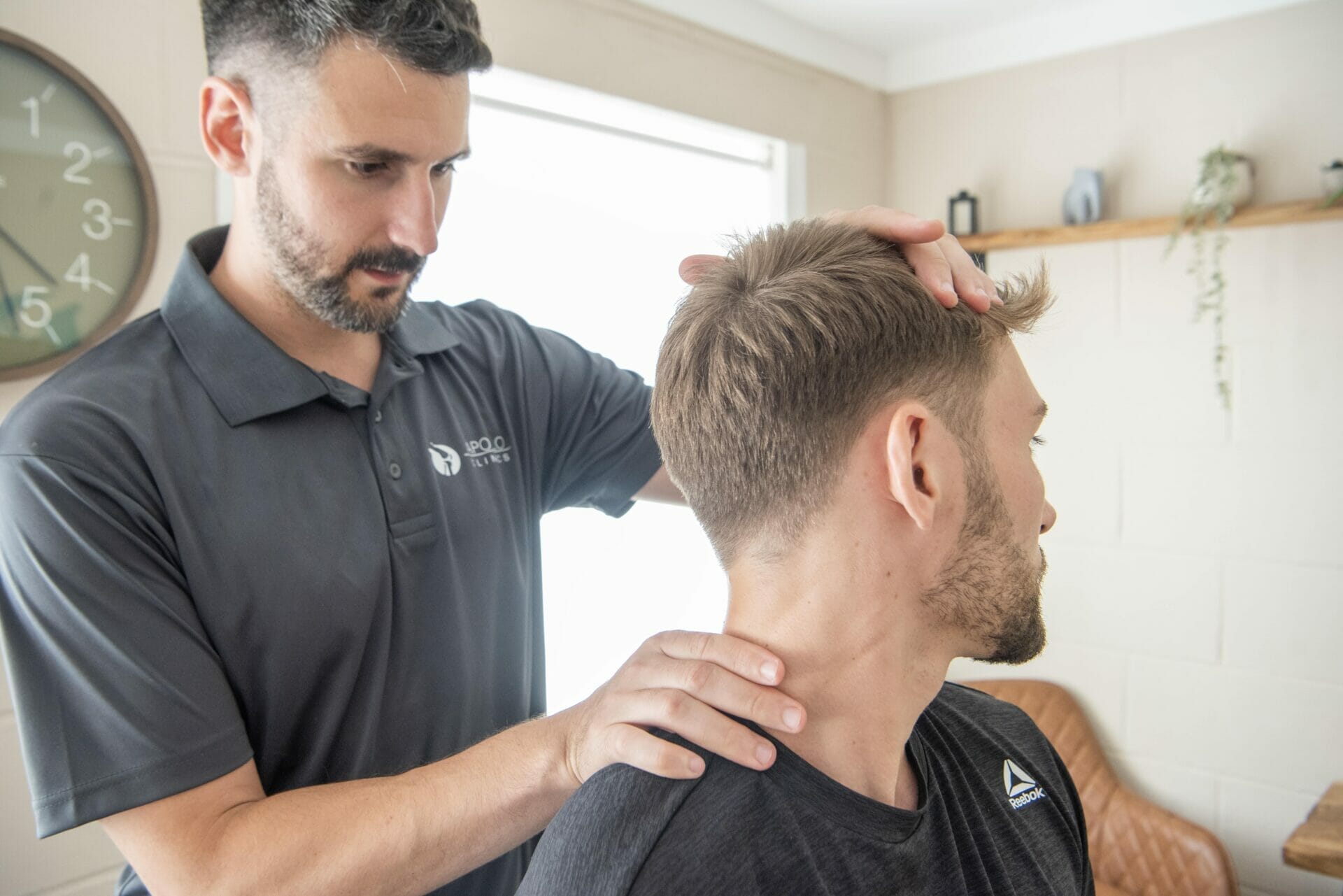 Osteopath in Sevenoaks assessing patient's neck pain for osteopathy treatment